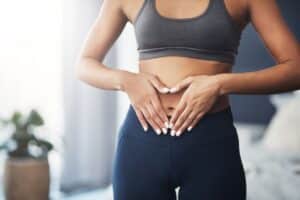 women-touching-belly-fat