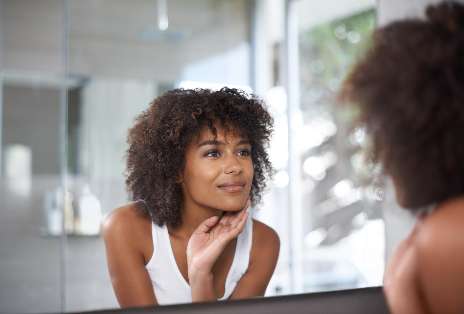 african american women seeing in mirror